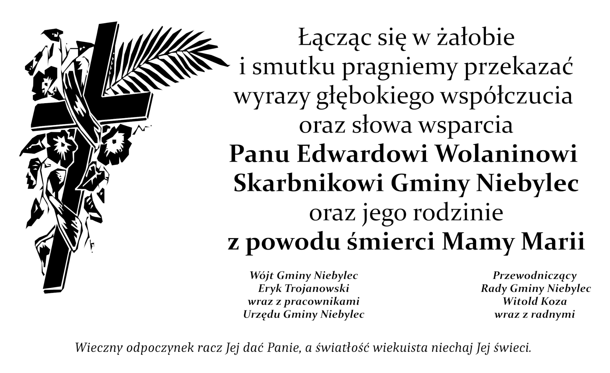Czarno-biała klepsydra z rysunkiem krzyża oplecionego kwiatami i palmową gałązką po lewej stronie. Po prawej umieszczony jest tekst kondolencji skierowany do Edwarda Wolanina, skarbnika gminy Niebylec, z powodu śmierci jego mamy Marii. Podpisy złożone przez wójta gminy Eryka Trojanowskiego z pracownikami urzędu oraz przewodniczącego rady gminy Witolda Kozę z radnymi. Na dole zamieszczona jest modlitwa „Wieczny odpoczynek racz Jej dać, Panie, a światłość wiekuista niechaj Jej świeci.”